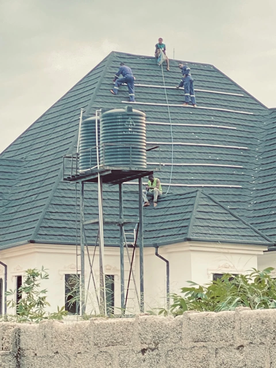 Technicians working on a rooftop solar installation